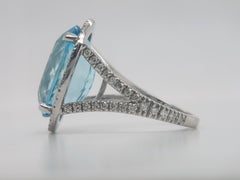 Platinum Ring with Oval Aquamarine That Weights 10.87 Cts and Halo Diamond Ring