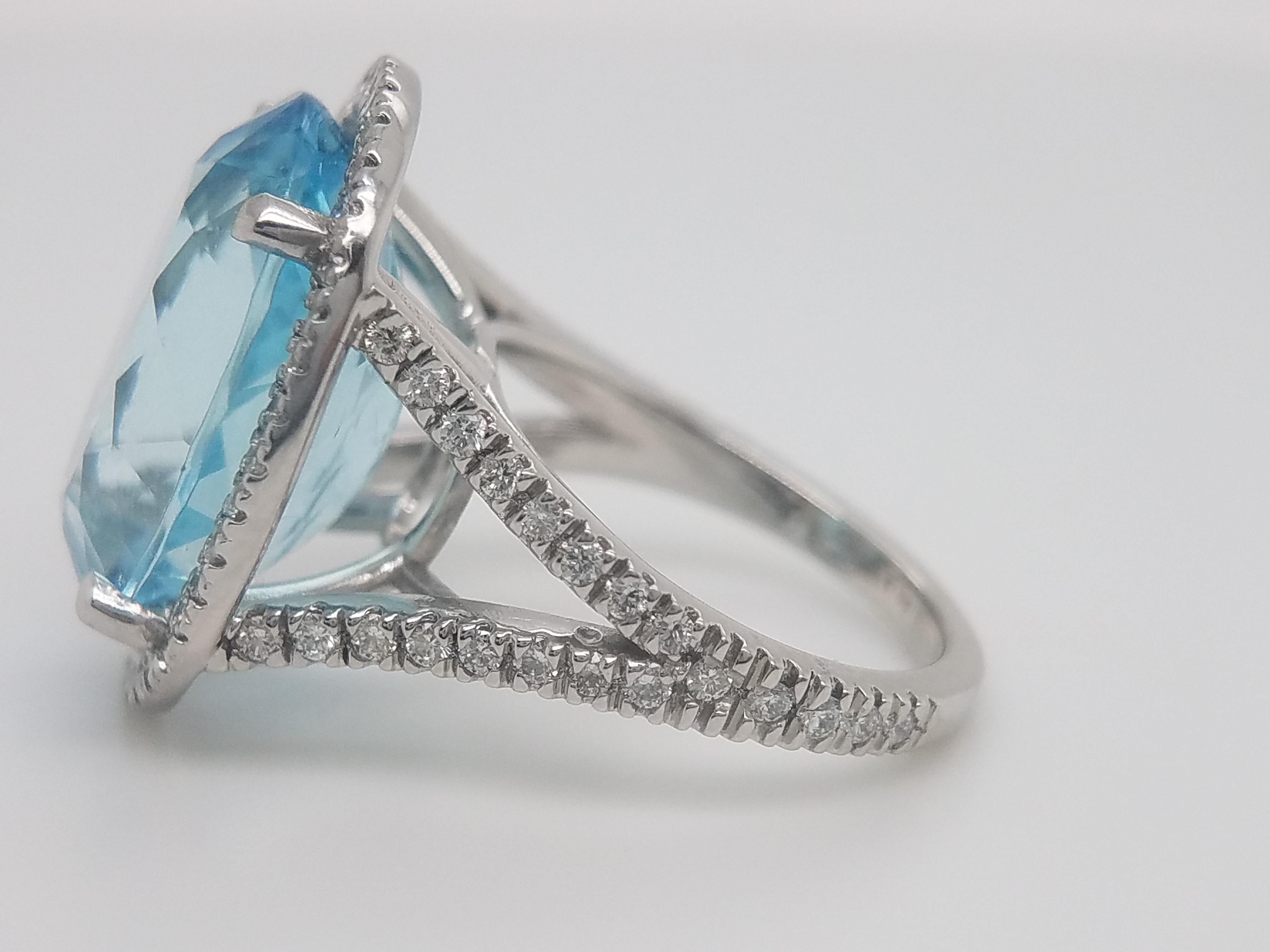 Contemporary Platinum Ring with Oval Aquamarine That Weights 10.87 Cts and Halo Diamond Ring For Sale