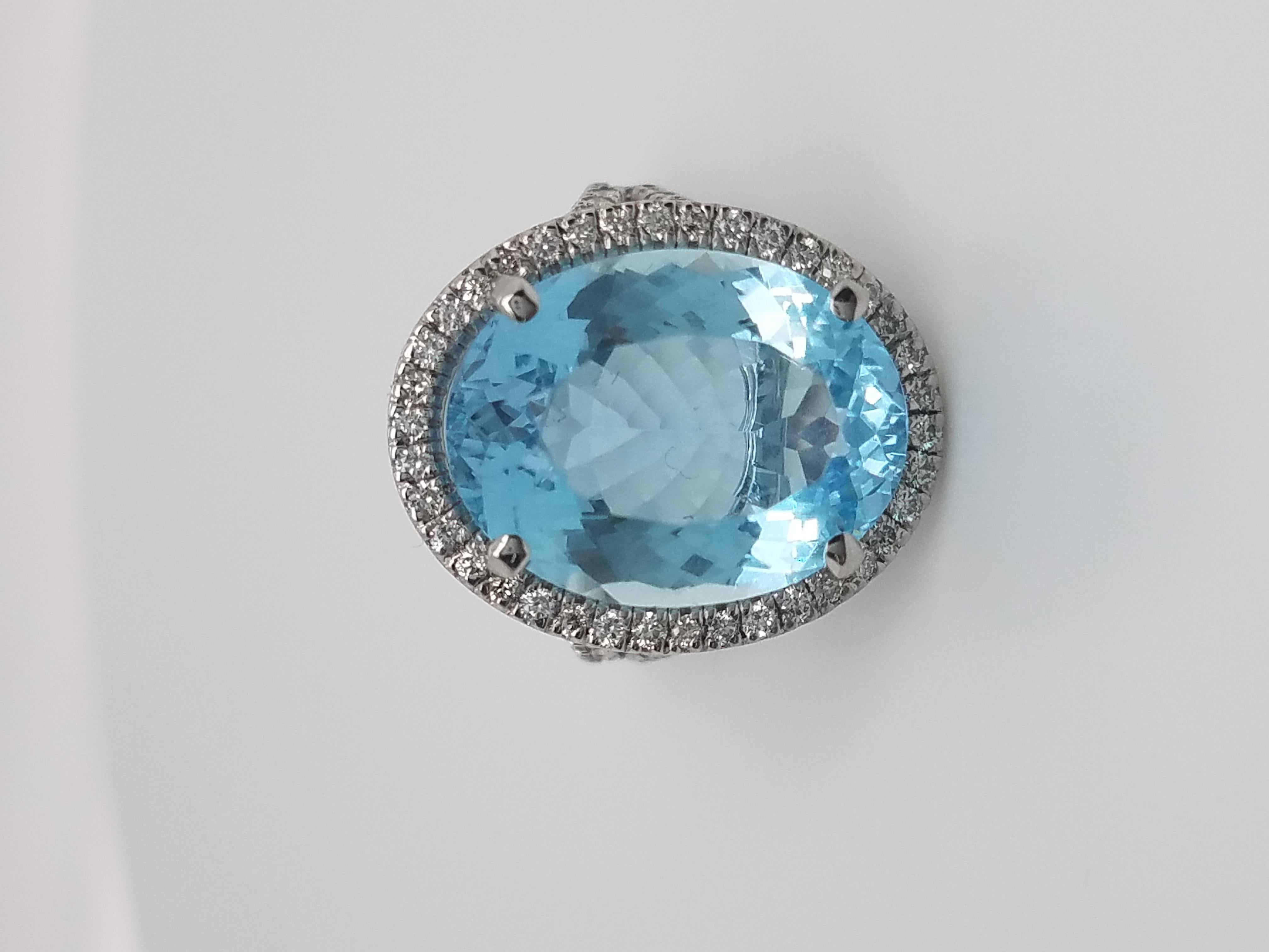 Platinum Ring with Oval Aquamarine That Weights 10.87 Cts and Halo Diamond Ring In New Condition For Sale In New York, NY