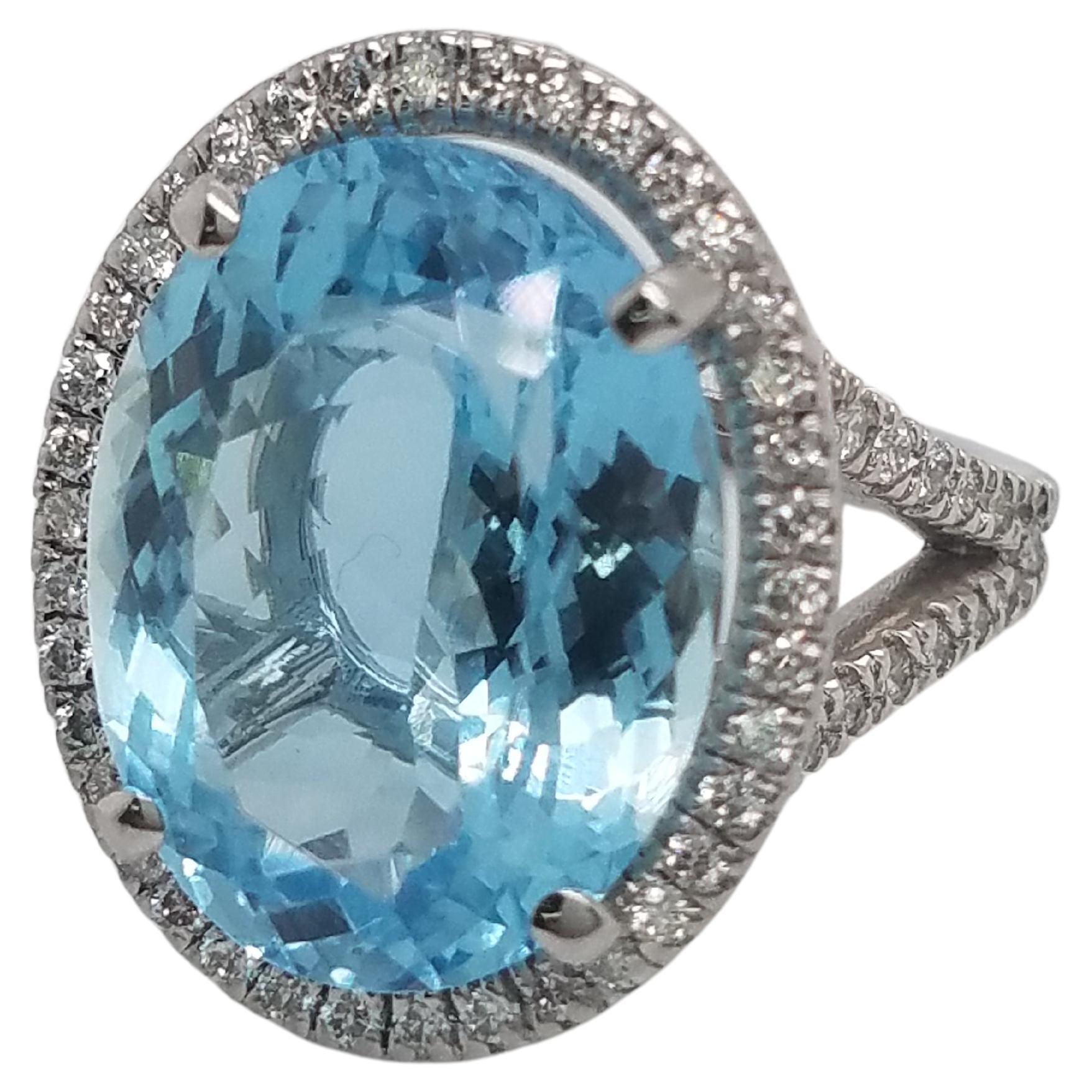Platinum Ring with Oval Aquamarine That Weights 10.87 Cts and Halo Diamond Ring For Sale