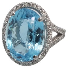 Platinum Ring with Oval Aquamarine That Weights 10.87 Cts and Halo Diamond Ring