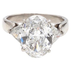 Platinum Ring with Oval & Trillion Cut Diamonds