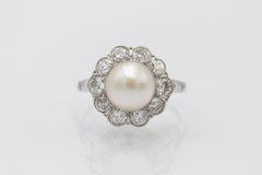 Platinum ring with pearl and diamonds 1.00ct, mid-20th century.