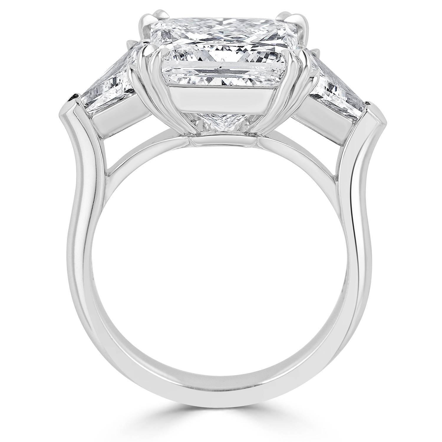 Platinum ring, set in the center with Princess cut Diamond, weigh 5.02 carats D color SI1 clarity, GIA certified, flanked by two Trillion cut Diamonds, total weight 1.20 carats. D color SI clarity.
Ring's total Diamond weight 6.22 carats.