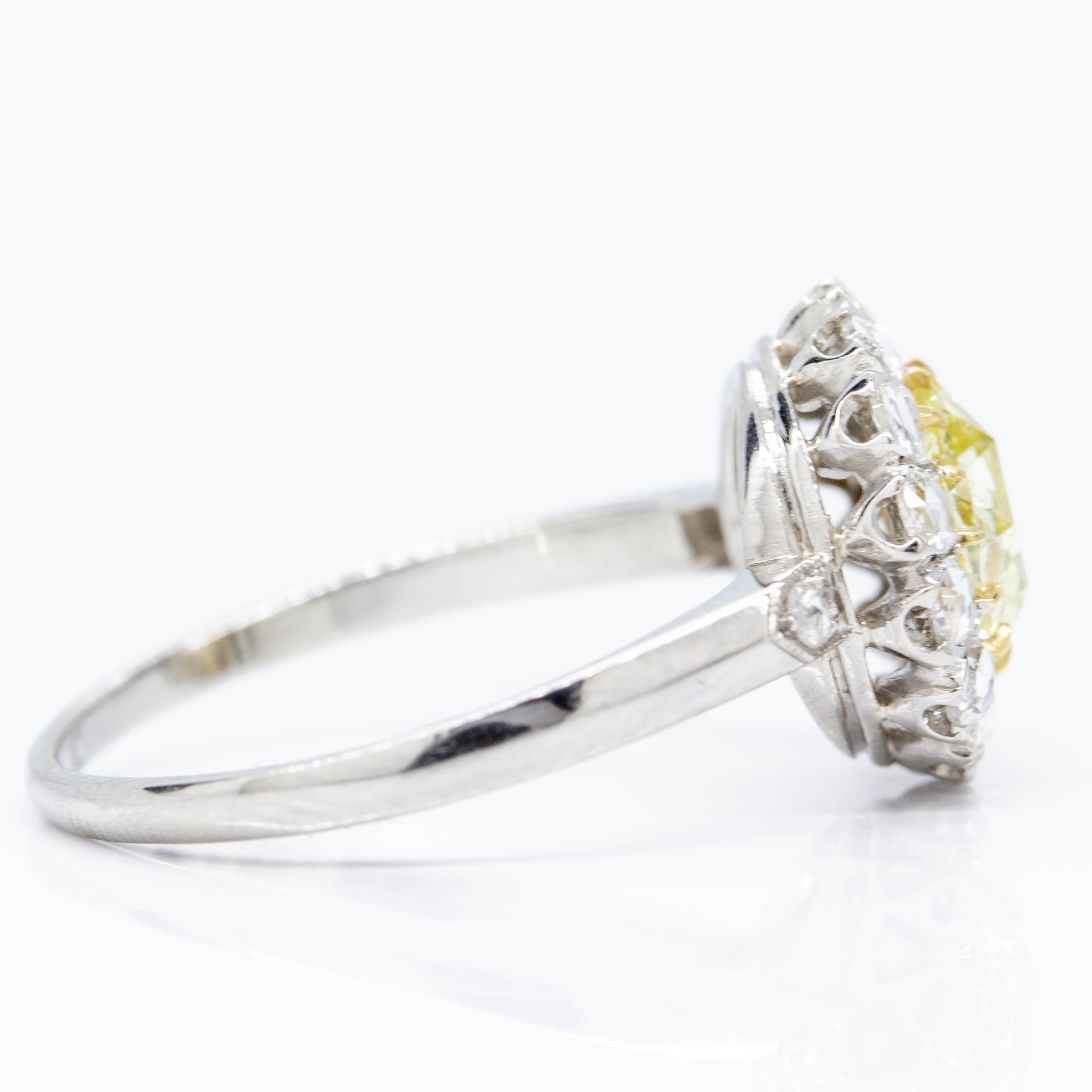Composition: Platinum
•	1 rose cut diamond fancy yellow SI1 0.81ctw.
•	16 rose cut diamonds H-VS2 0.50ctw.
Ring size: 7
Ring face measure: 12mm by 12mm
Rise above finger: 6mm
Total weight:  4.2grams – 2.5dwt
