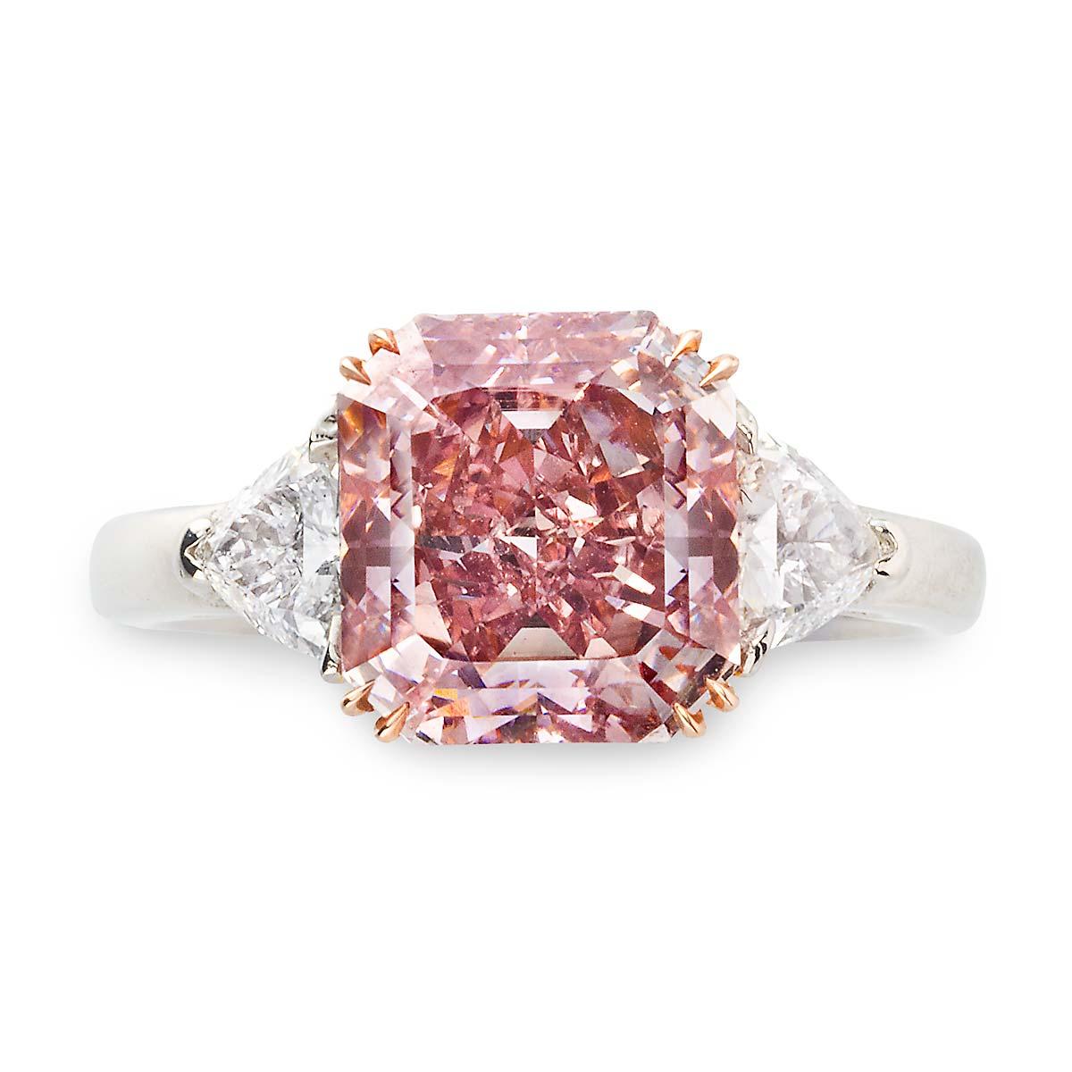 Platinum Rose Gold 3.61cts Fancy Brown- Purple,  SI1 clarity GIA, Diamond Ring.
Set with 2 Tri. Diamonds .71cts 