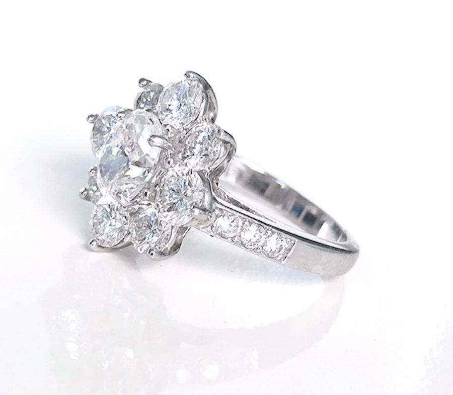 Contemporary Platinum Rosette Diamond Ring, Oval Center Diamond For Sale