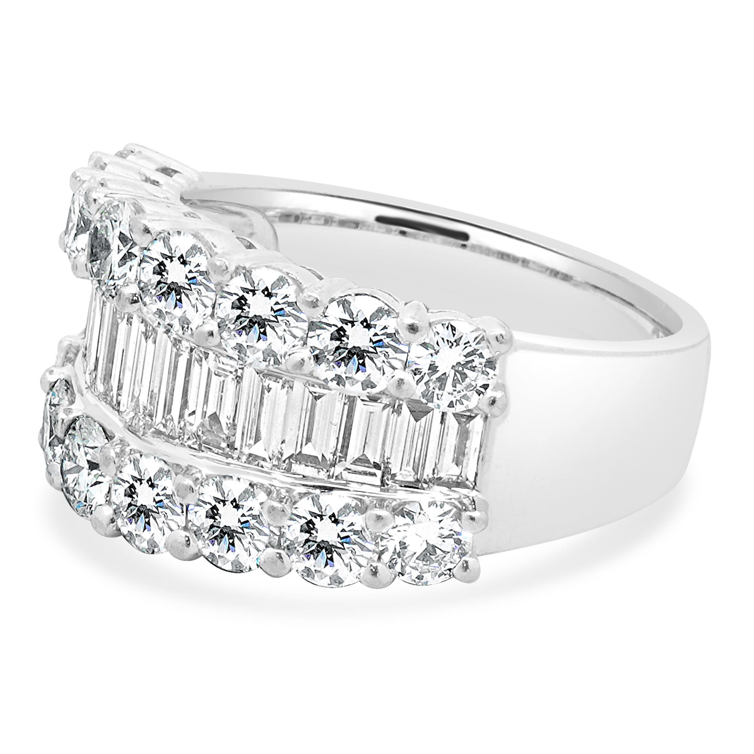 Material: platinum
Diamond: 16 round brilliant cut = 2.15cttw
Color: H
Clarity: SI1
Diamond: 15 baguette cut = 1.00cttw
Color: H
Clarity: SI1
Ring Size: 7 (please allow up to 2 additional business days for sizing requests)
Weight: 14.30 grams
