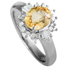 Platinum Round and Baguette Diamonds and Imperial Topaz Ring