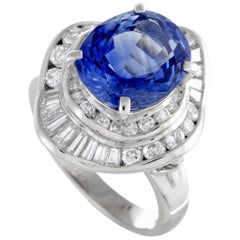 Platinum Round and Tapered Baguette Diamond and Oval Sapphire Ring