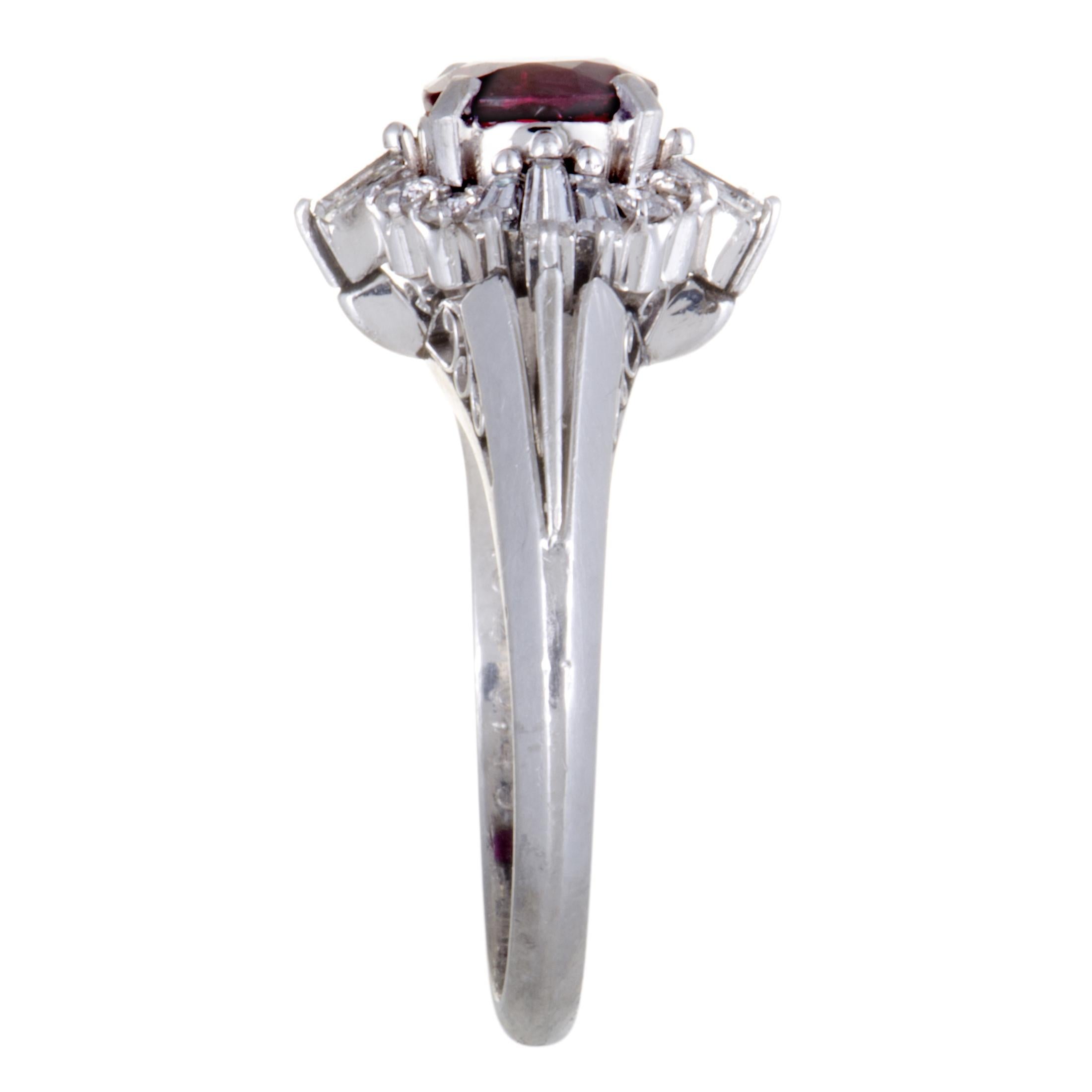 This elegant and classy ring is crafted in glistening platinum. This stunning ring displays a mesmerizing and captivating appeal with its spectacular embellishment of a gorgeous ruby, weighing 1.32ct, surrounded by 0.49ct of stunning diamonds.
Ring