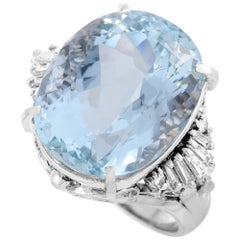 Platinum Round and Tapered Baguette Diamonds and Aquamarine Oval Ring