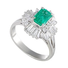 Platinum Round and Tapered Baguette Diamonds and Emerald Oval Ring