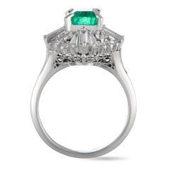 Platinum Round and Tapered Baguette Diamonds and Emerald Ring