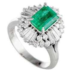 Platinum Round and Tapered Baguette Diamonds and Emerald Ring