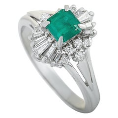 Platinum Round and Tapered Baguette Diamonds and Emerald Ring