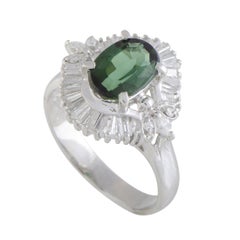Platinum Round and Tapered Baguette Diamonds and Green Tourmaline Oval Ring