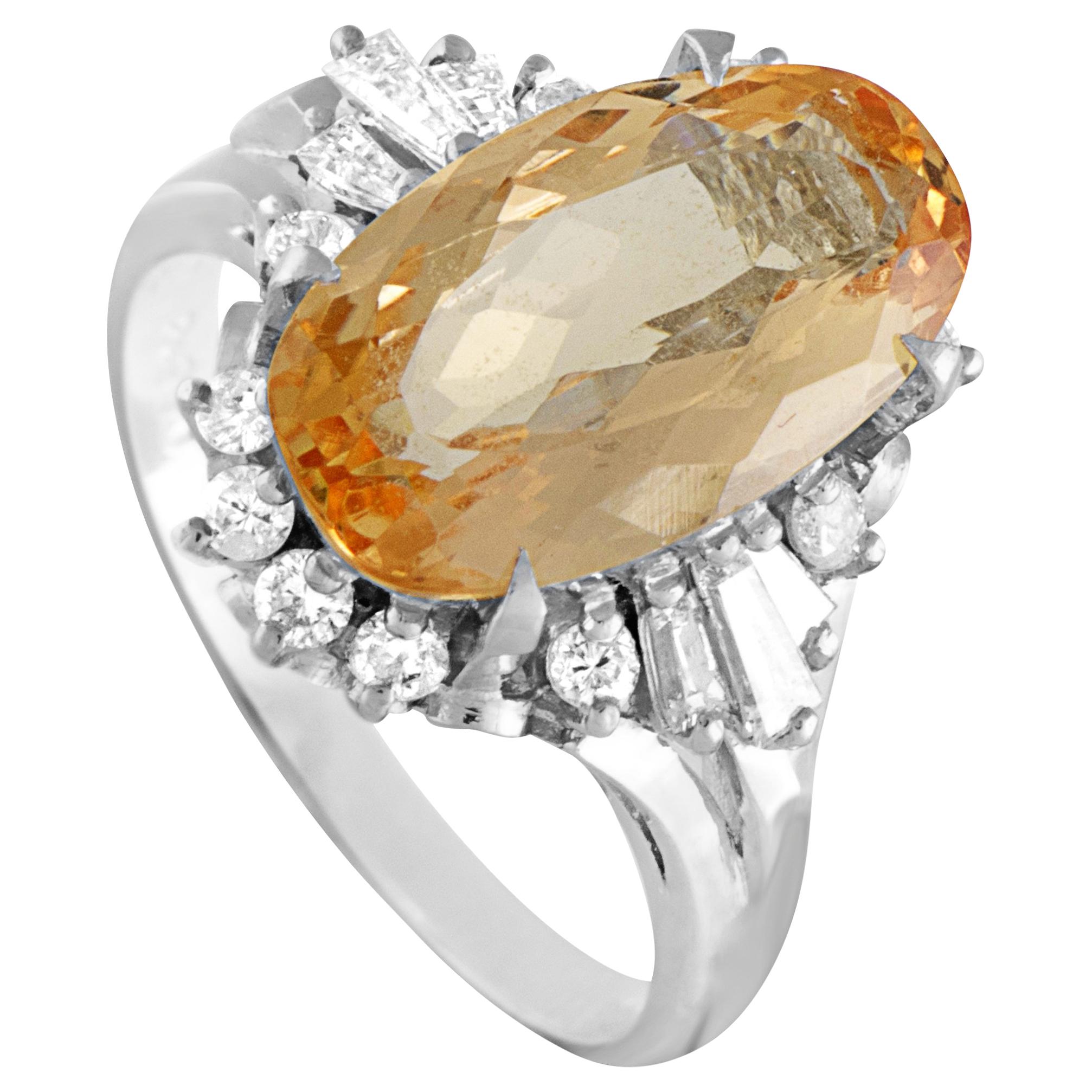 Platinum Round and Tapered Baguette Diamonds and Imperial Orange Oval Topaz Ring