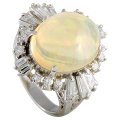 Platinum Round and Tapered Baguette Diamonds and Opal Oval Ring