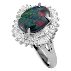 Platinum Round and Tapered Baguette Diamonds and Opal Oval Ring