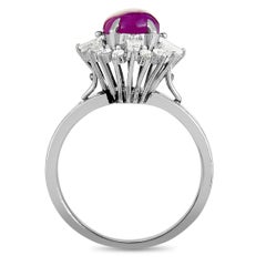 Platinum Round and Tapered Baguette Diamonds and Ruby Cabochon Oval Ring