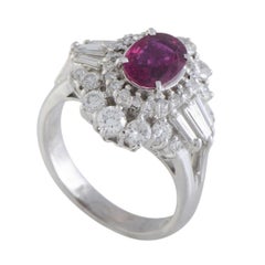 Platinum Round and Tapered Baguette Diamonds and Ruby Oval Ring