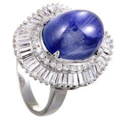 Platinum Round and Tapered Baguette Diamonds and Sapphire Cabochon Oval Ring
