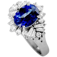 Platinum Round and Tapered Baguette Diamonds and Sapphire Oval Ring
