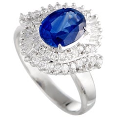 Platinum Round and Tapered Baguette Diamonds and Sapphire Oval Ring