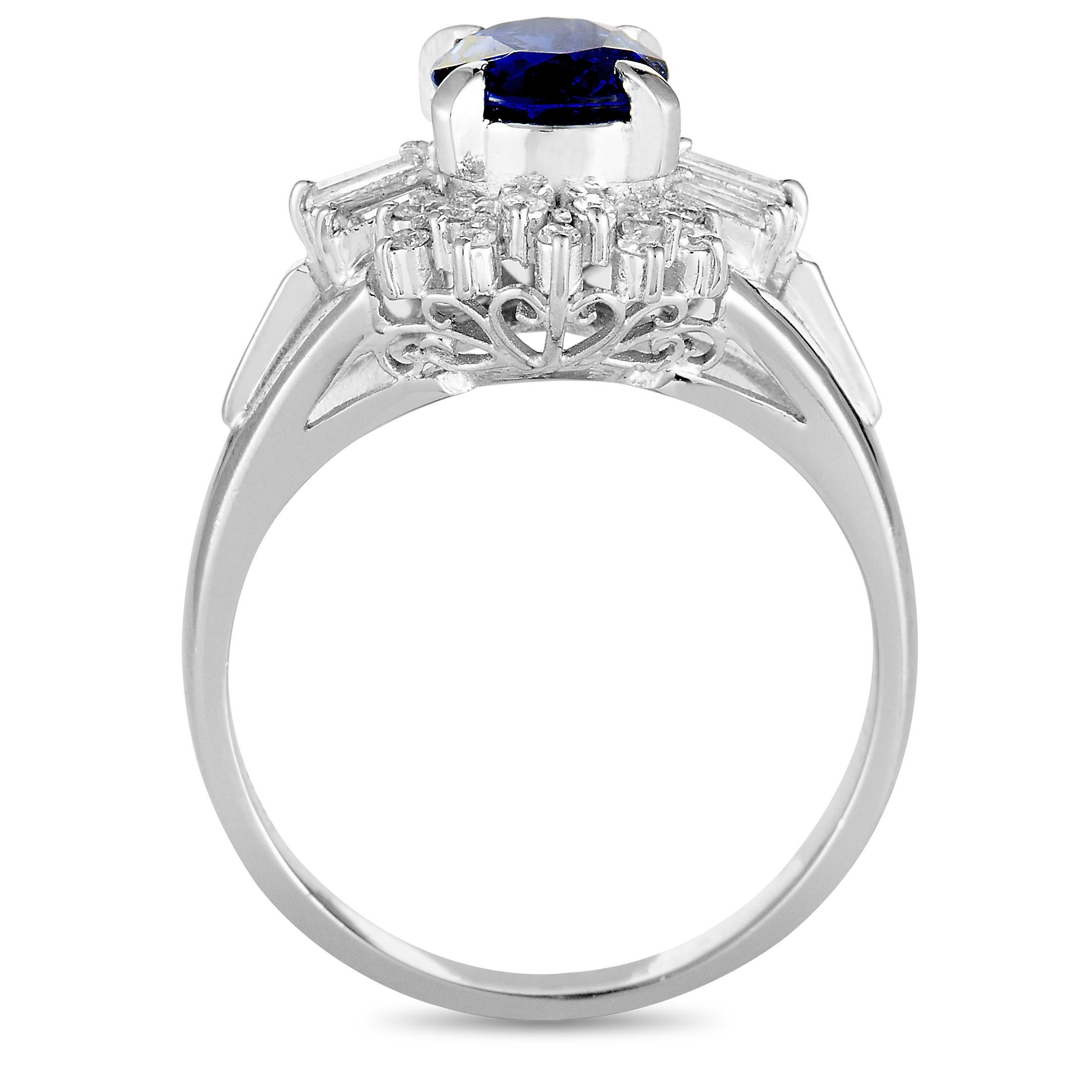 This ring is crafted from platinum and set with a sapphire that weighs 1.20 carats and with round and tapered baguette diamonds that amount to 0.19 carats. The ring weighs 5.9 grams, boasting band thickness of 2 mm and top height of 7 mm, while top