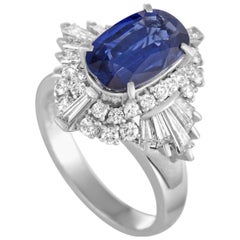 Platinum Round and Tapered Baguette Diamonds and Sapphire Ring
