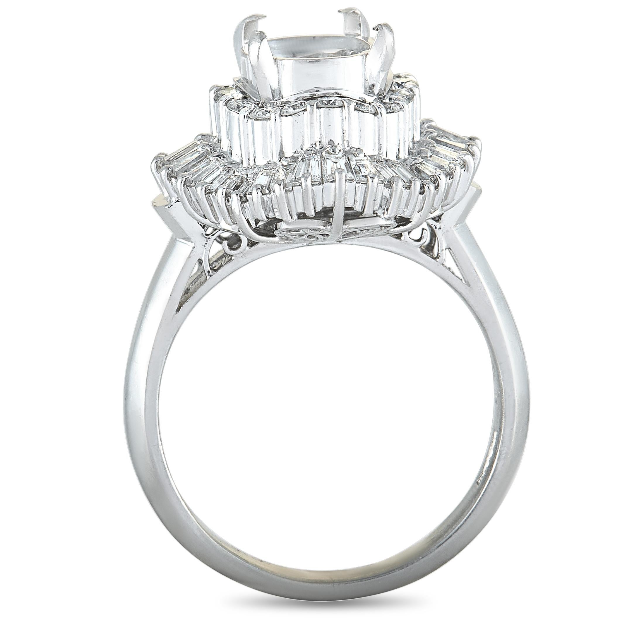 This mounting ring is crafted from platinum and weighs 9.1 grams, boasting band thickness of 2 mm and top height of 11 mm, while top dimensions measure 15 by 16 mm. The ring is embellished with round and tapered baguette diamond stones that weigh