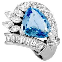 Platinum Round, Baguette, and Marquise Diamonds and Aquamarine Trillion Ring