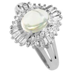 Platinum Round, Baguette, and Tapered Baguette Diamond and Opal Oval Ring Platinum Round, Baguette, and Tapered Baguette Diamond and Opal Oval Ring