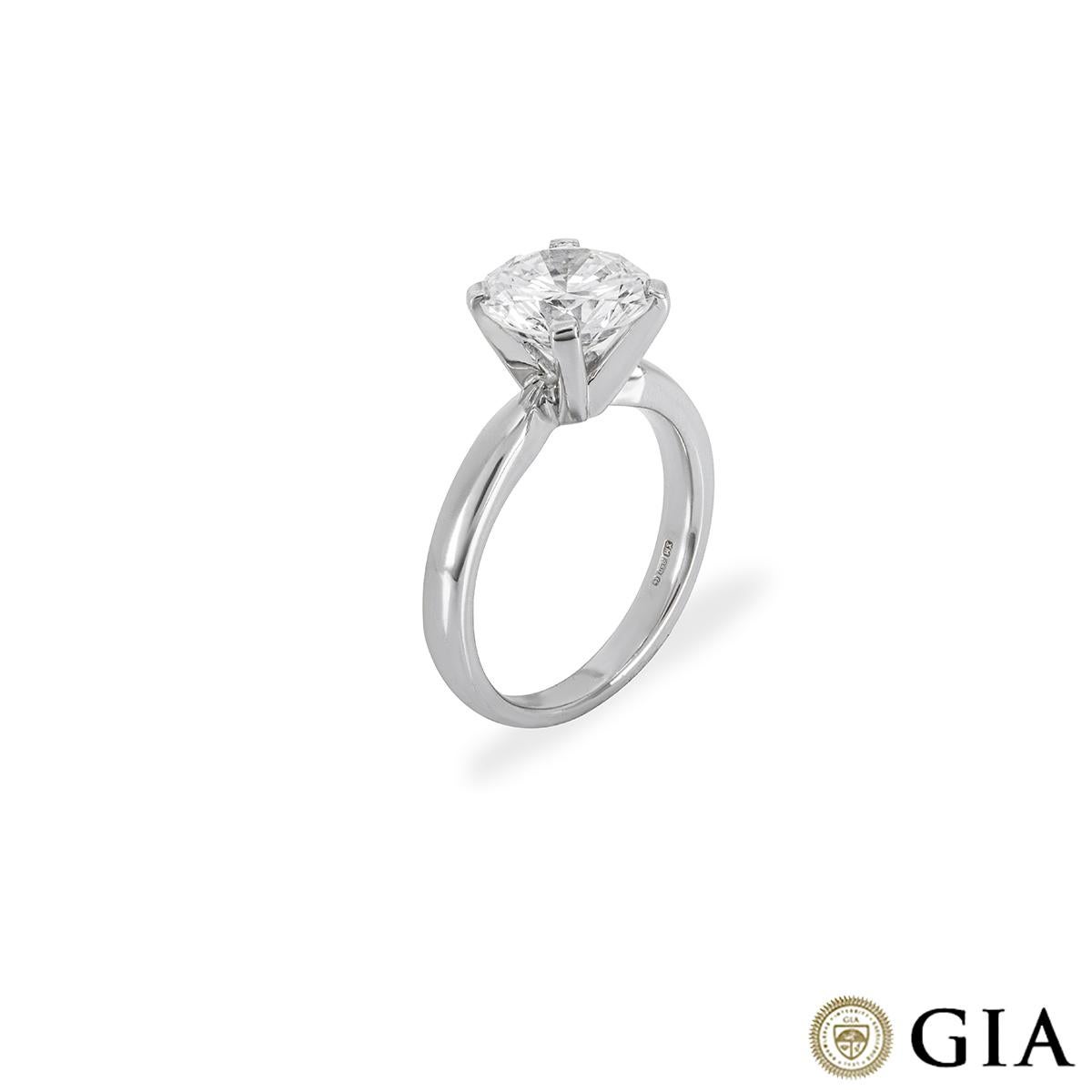 A beautiful platinum diamond engagement ring. The solitaire is adorned with a round brilliant cut diamond set in a four prong mount, weighing 2.24ct, I colour and VS2 in clarity. The 2.5mm ring has a gross weight of 5.95 grams and is currently a UK