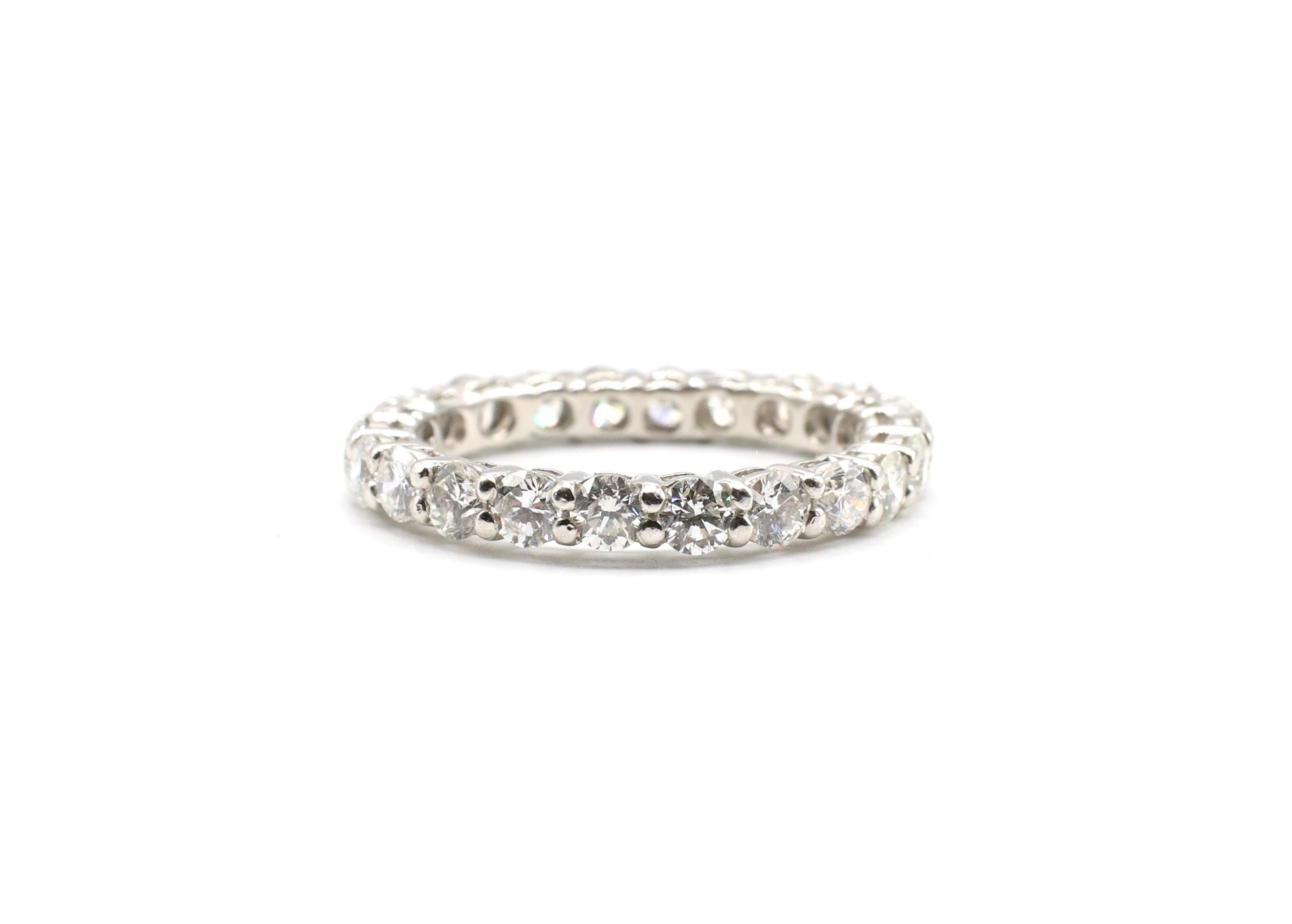 Vintage Platinum Round Brilliant Cut Diamond Eternity Band Ring 2.5 CTW Size 8.5

Metal: Platinum, marked PT900
Weight: 5.11 grams
Diamonds: 22 round brilliant cut diamonds, approx. 2.5 ctw G-H VS. 
Size: 8.5
Width: 3.1mm wide 
Recently polished