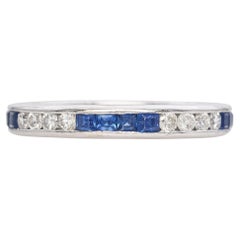 Platinum Round Brilliant Diamond and Calibre Cut Blue Sapphire Band