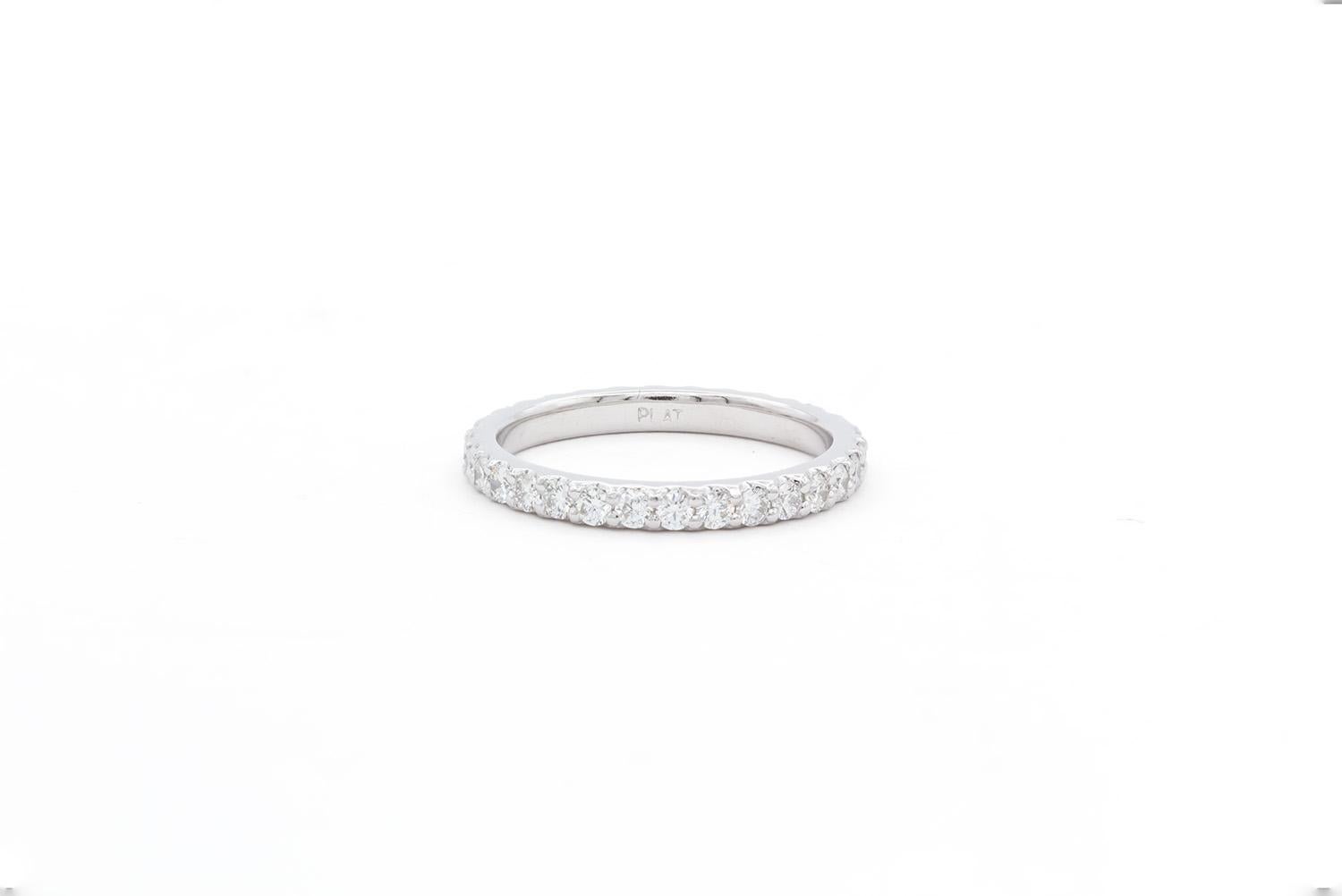 We are pleased to offer this Platinum Round Brilliant Diamond Eternity U Pave Wedding Band. This beautiful wedding band features an eternity style band with an estimated 0.90ctw F-G/VS-SI round brilliant cut diamonds all set in a stunning platinum u