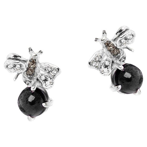 Clous d'oreilles en platine avec onyx de taille ronde et diamants noirs et blancs 0,16 carat