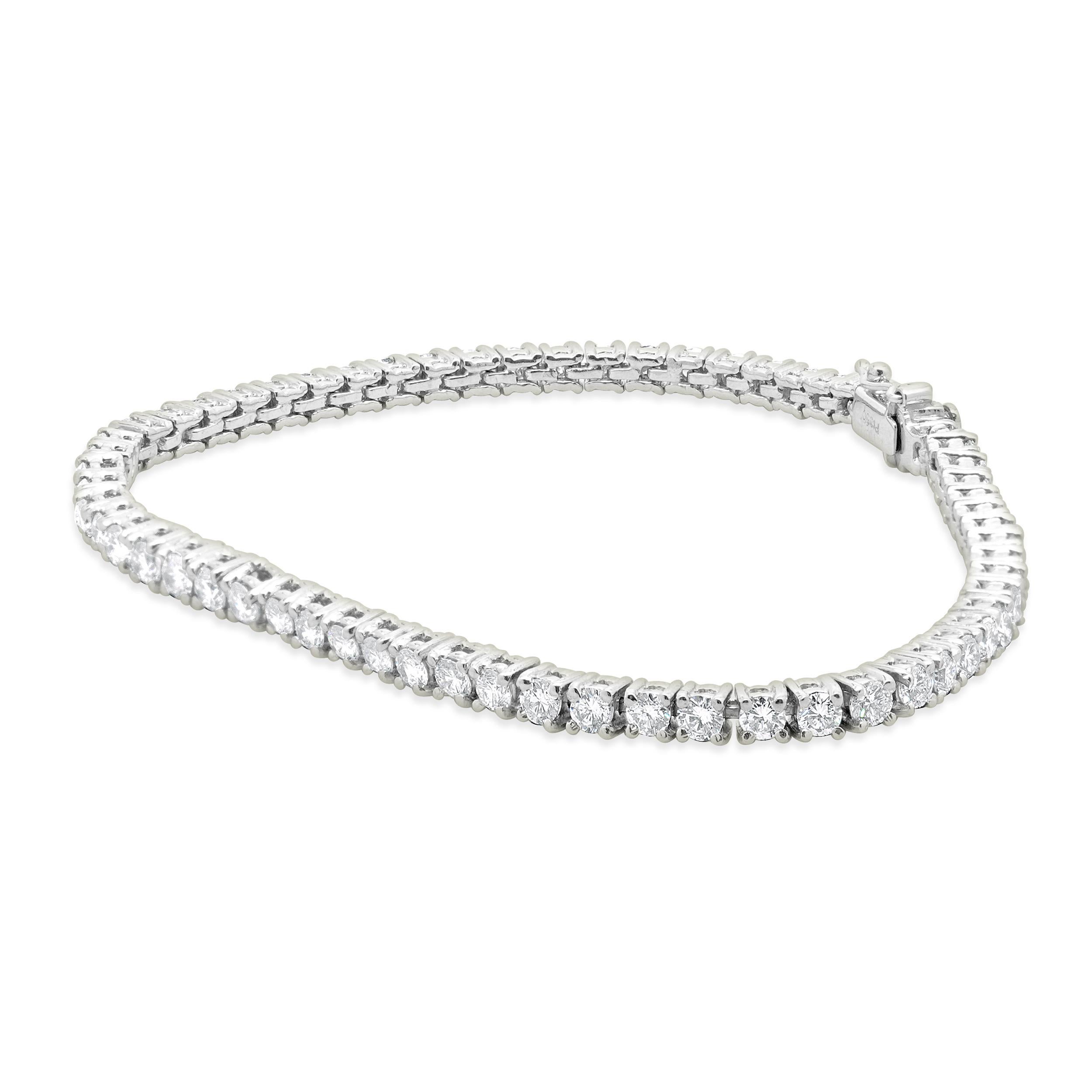 Designer: custom design
Material: platinum
Diamond: 63 round brilliant cut = 3.15cttw
Color: G
Clarity: SI2
Dimensions: bracelet will fit up to a 7-inch wrist
Weight: 15.97 grams
