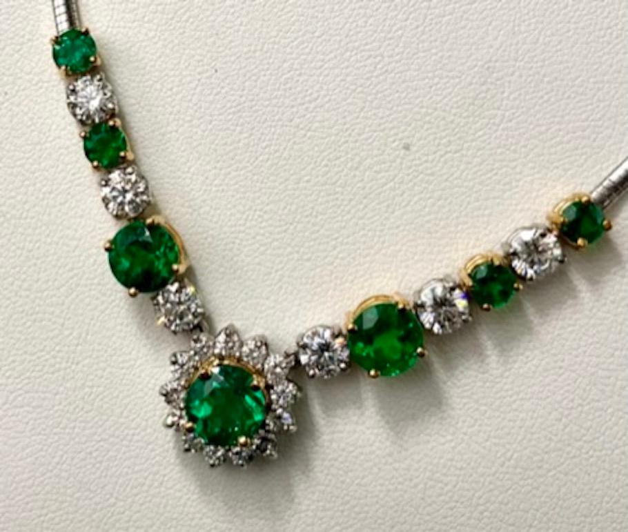 This necklace features a gorgeous 1.75Ct  Round Emerald surrounded by a halo of natural white diamonds. The next 2 Emeralds are equally eye catching and weigh 1.62Ct and 1.61Ct each respectively.  The six natural white diamonds have a combined