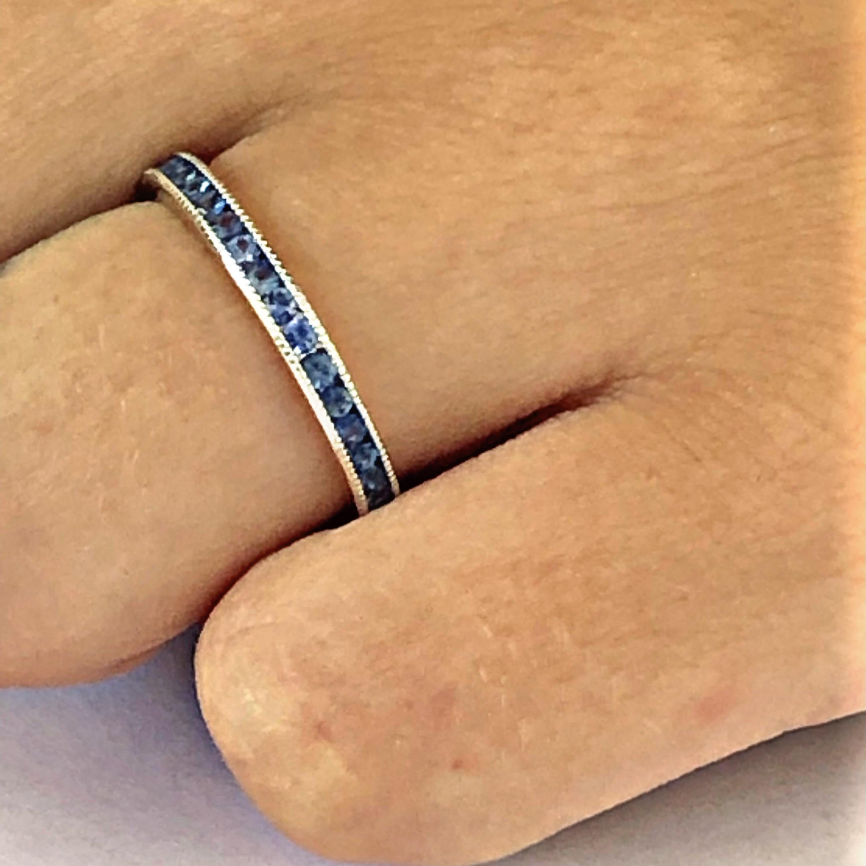 Platinum channel set round diamond cut sapphires eternity stacking or anniversary band 
Sapphire weighing 1.30 carat 
Millgrain edge
New ring 
Our team of graduate gemologists carefully hand-select every diamond and sapphire. 
Ring size 6 In