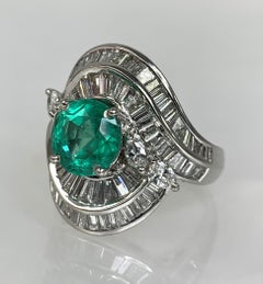 Platinum Round Shaped Emerald Diamond Ring