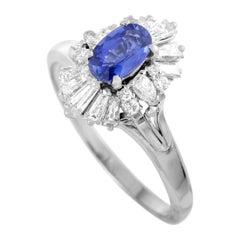 Platinum Round, Tapered Baguette and Pear Diamonds and Sapphire Oval Ring