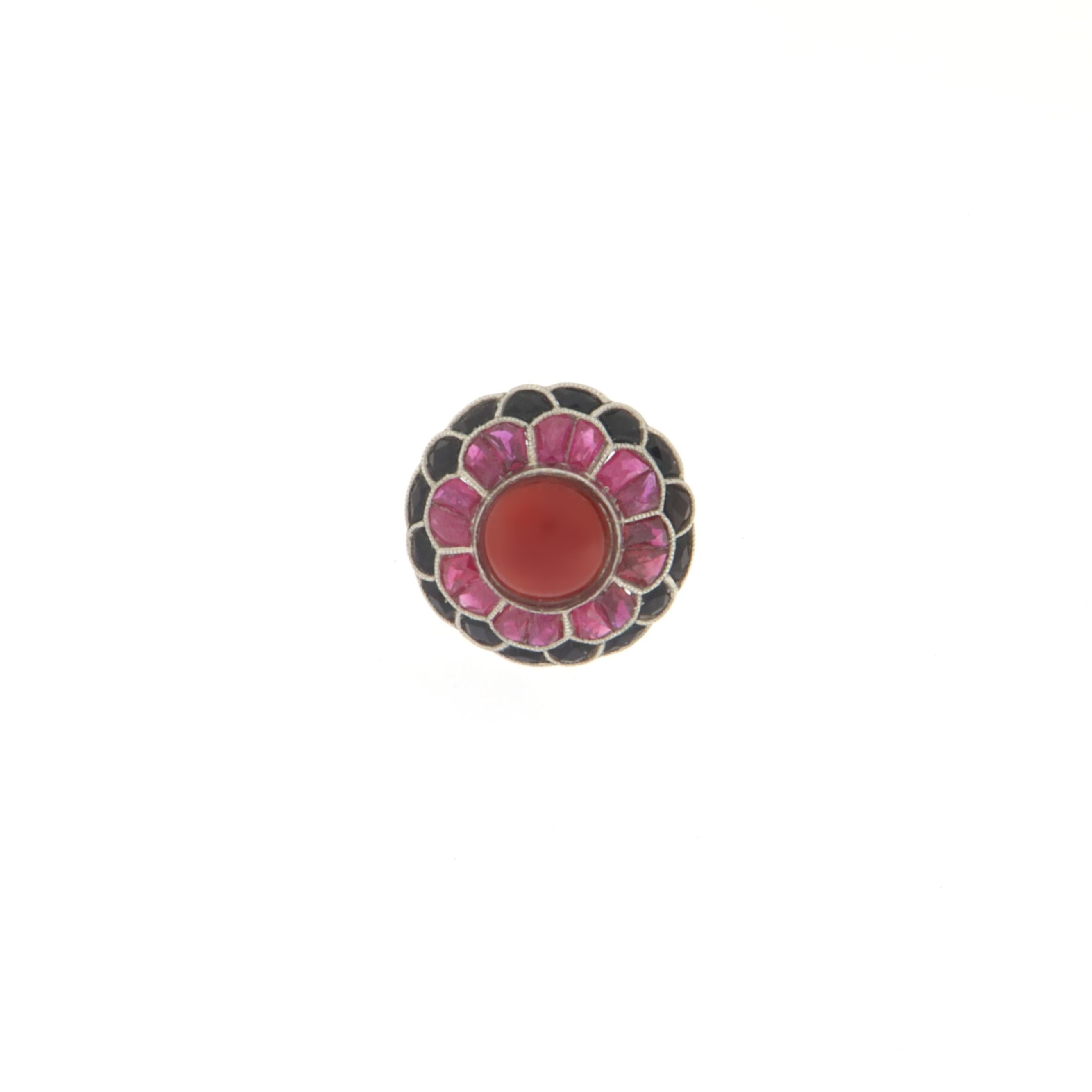 Fantastic platinum cocktail ring.Handmade by artisans assembled with coral,rubies,onyx and diamonds

Ring total weight 7.30 grams
Rubies weight 1.15 karat
Diamonds weight 0.27 karat
Ring size 7.5 us
(all rings are can be resized)


