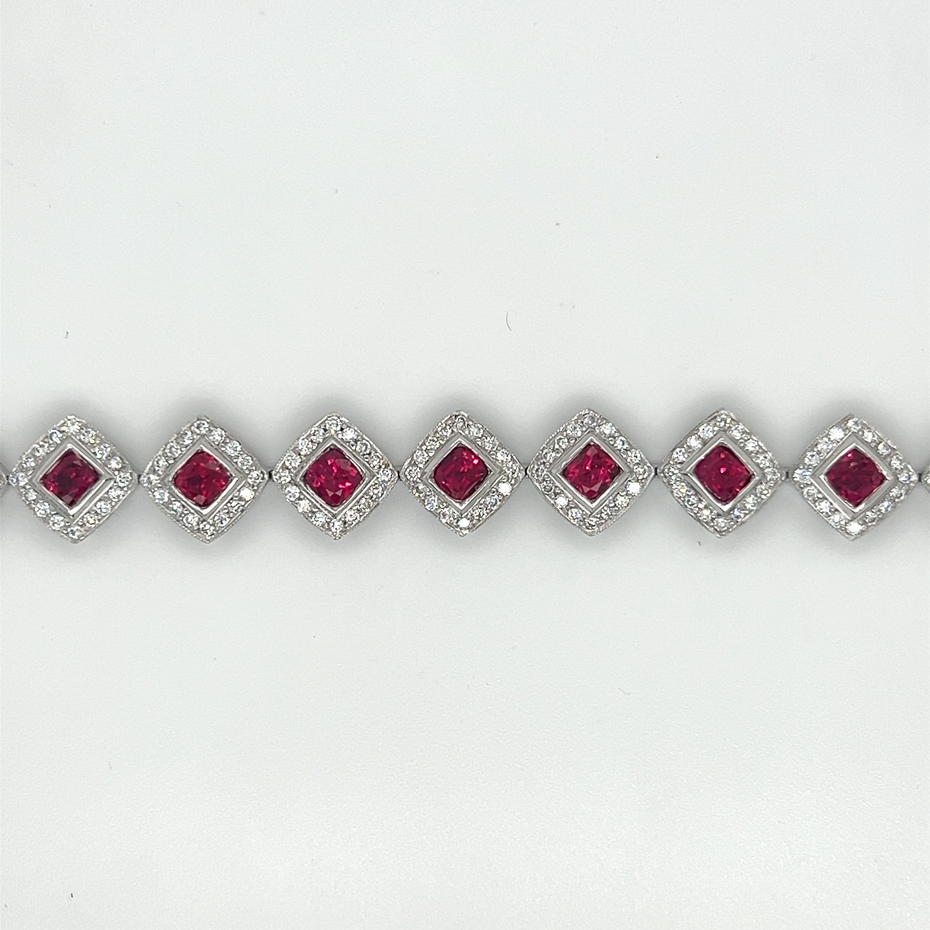 Crafted in platinum, this piece features 6.55 carats of rubies and 2.45 carats of diamonds. The diamonds are G color, and VS1 clarity. The backside of the bracelet has heart shape metal work.