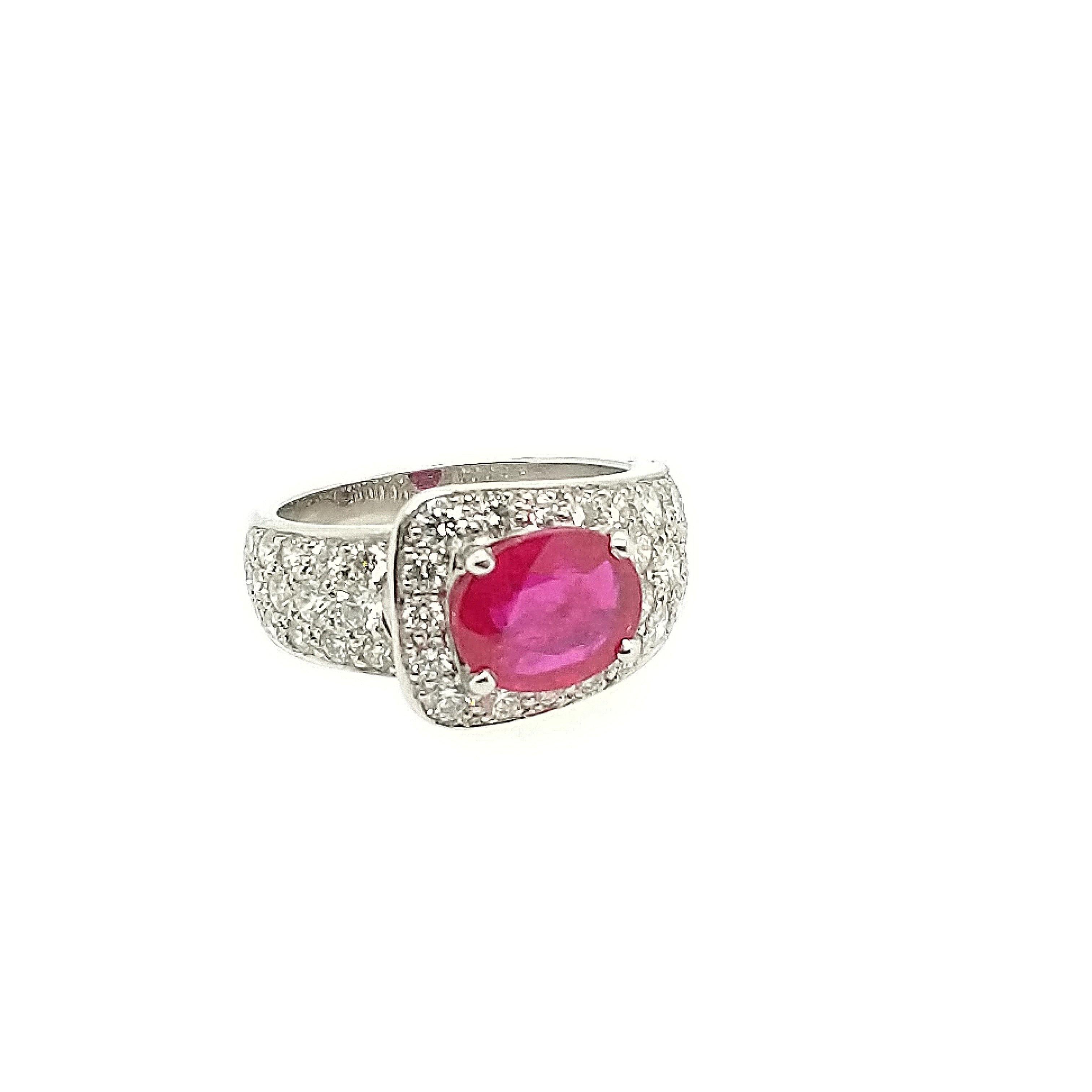 This Ruby and diamond ring is crafted in Platinum and features (1) oval ruby burma ring with a deep red color weighing 2.24ct. The mounting is created by Gumuchian and features (45) brilliant round diamonds weighing 1.72cttw with a color of G/H and