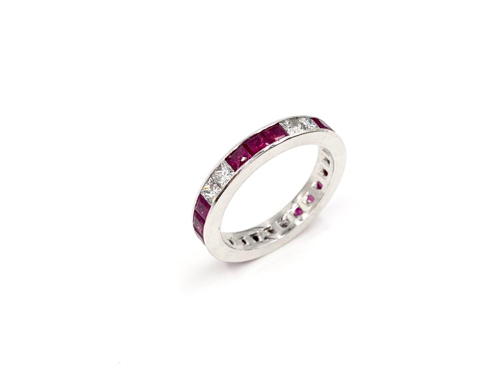 A sleek and well made platinum eternity channel set 3.5mm band featuring 4.12 carats of french cut rubies and 2.20 carats of princess cut diamonds set in a beautiful pattern with two diamonds for every 3 rubies. Diamond quality is approximately G