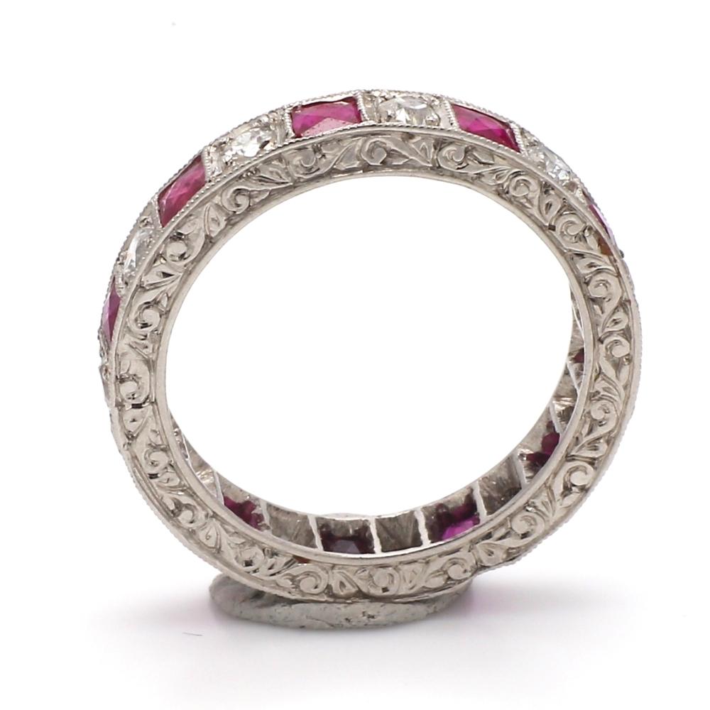 Platinum eternity band. Band is set with eleven (11) old mine cut diamonds and eleven (11) French cut rubies weighing 0.85ctw. Band weighs 5.2 grams and is a size 7. 
All questions answered. 
All reasonable offers are considered!