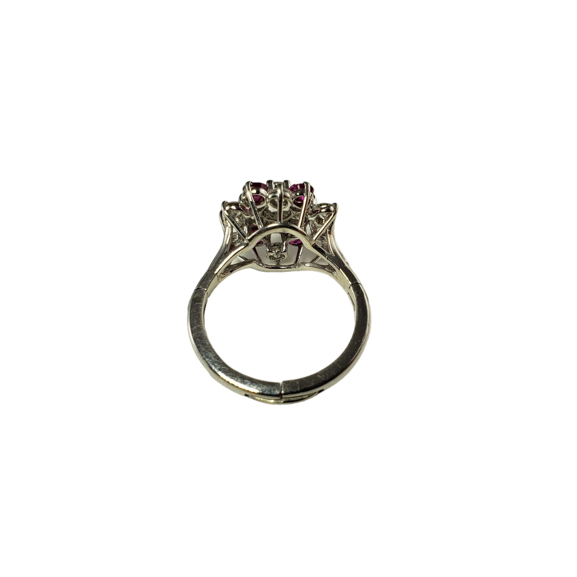 Vintage Platinum Ruby and Diamond Expandable Ring Size 7.75 JAGi Certified-

This stunning ring features 13 round brilliant cut diamonds and six natural rubies set in beautifully detailed platinum. The shank of the ring opens to fit over knuckle